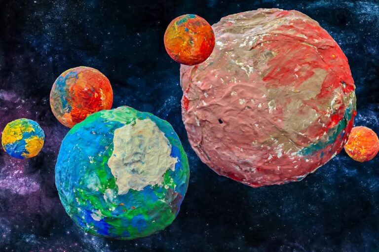 EIFA Colorful, textured planets made from painted clay float in a star-filled outer space background—perfect inspiration for International Open Day, with one large blue-green and one large red planet surrounded by smaller multicolored ones.